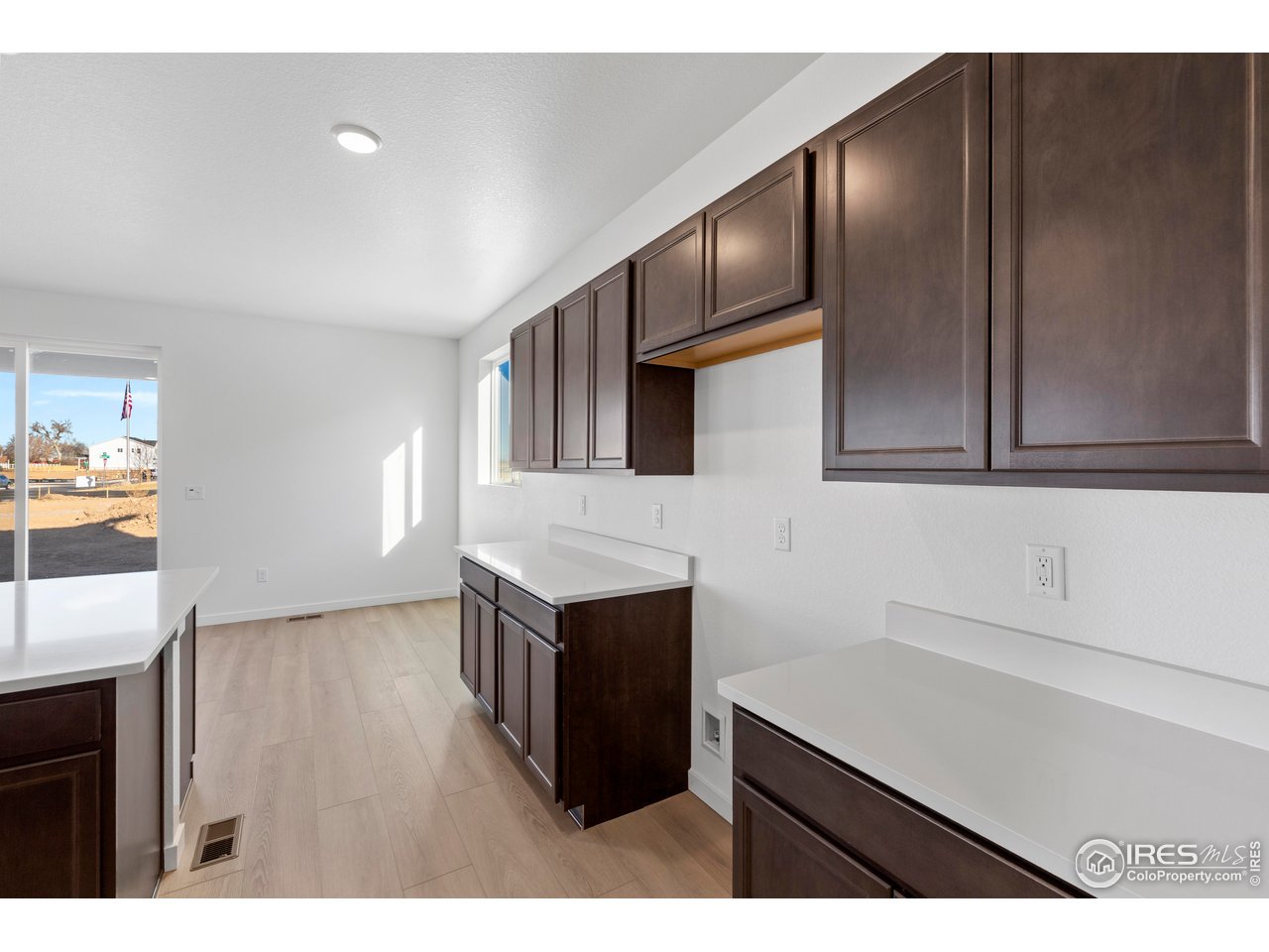 1472 Boyle Street Windsor, CO 80550 - Photo 11 of 25 a kitchen with stainless steel appliances cabinets a sink and a stove