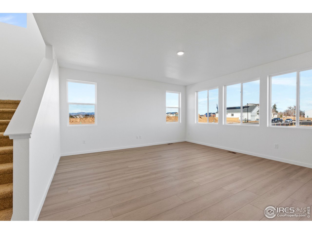 1472 Boyle Street Windsor, CO 80550 - Photo 12 of 25 a view of an empty room with a window