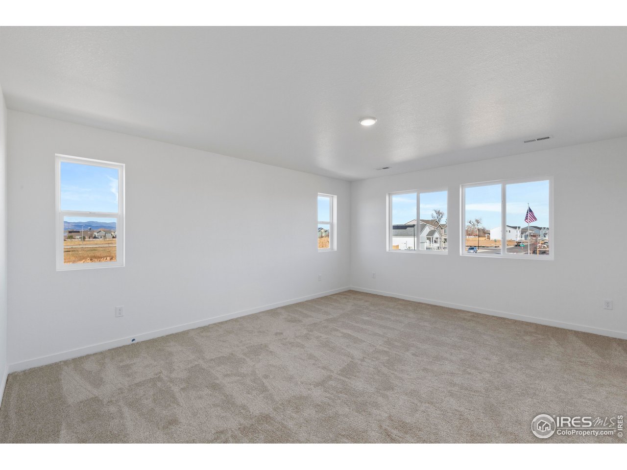 1472 Boyle Street Windsor, CO 80550 - Photo 17 of 25 a view of an empty room and window