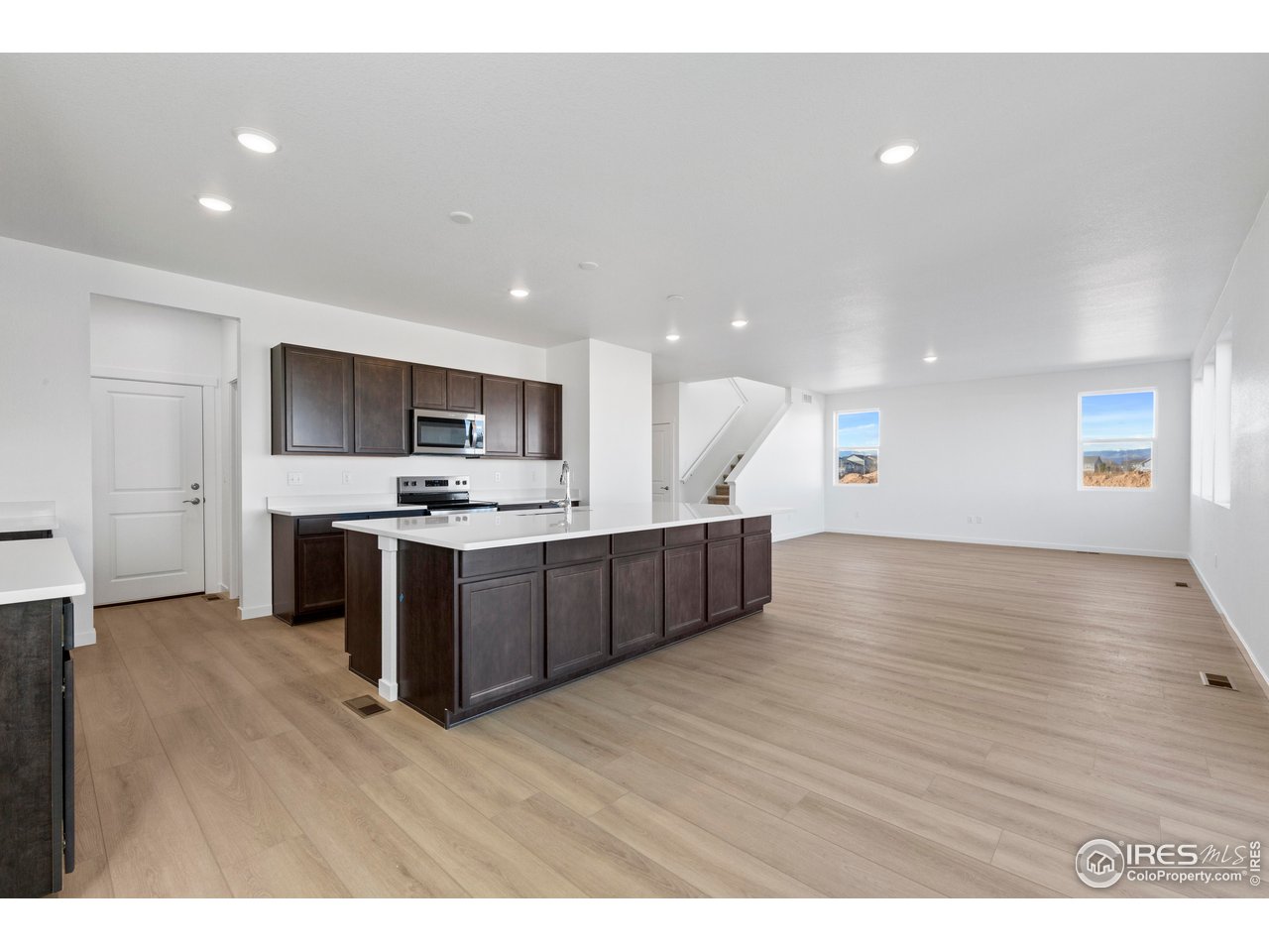 1472 Boyle Street Windsor, CO 80550 - Photo 5 of 25 a view of kitchen with kitchen island stainless steel appliances a sink and wooden floor