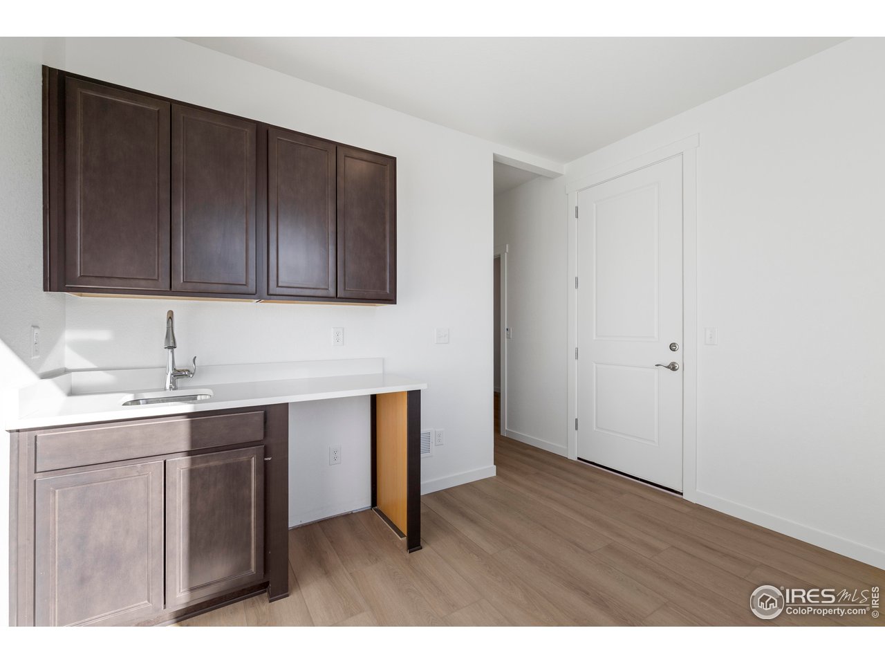 1472 Boyle Street Windsor, CO 80550 - Photo 10 of 25 a kitchen with a sink and cabinets