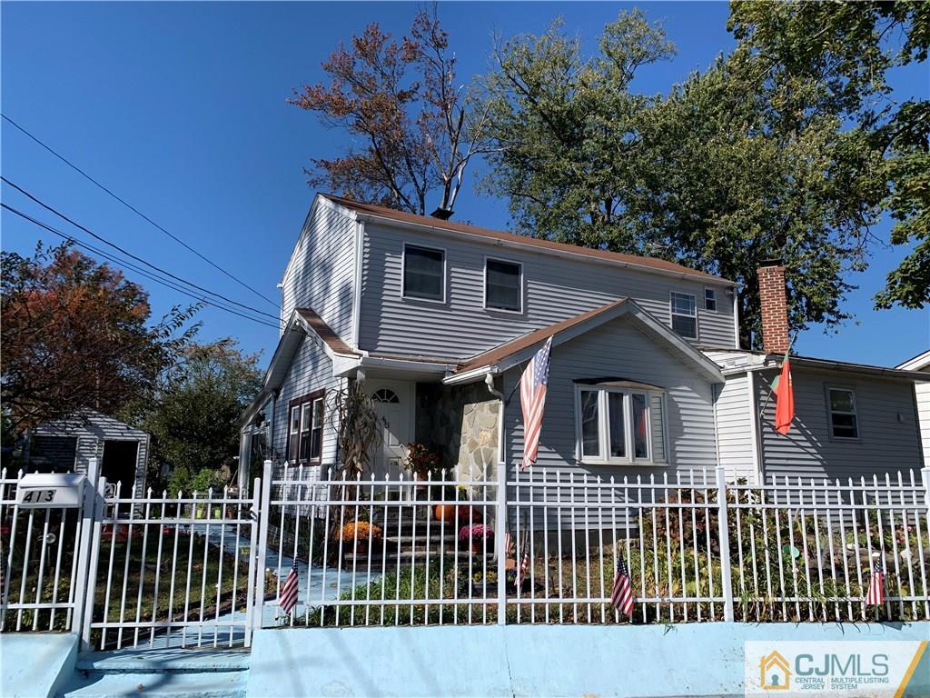413 Harding Road Old Bridge, NJ 08879 - Photo 1 of 18 a front view of a house with a garden