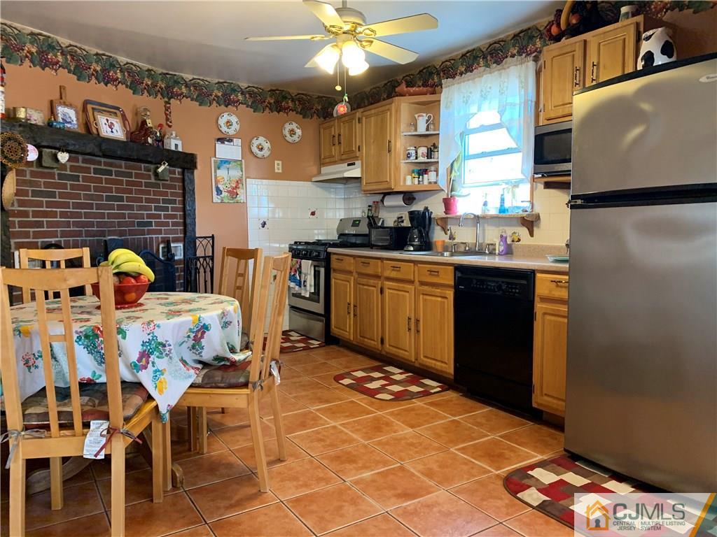 413 Harding Road Old Bridge, NJ 08879 - Photo 5 of 18 a kitchen with a sink appliances and cabinets