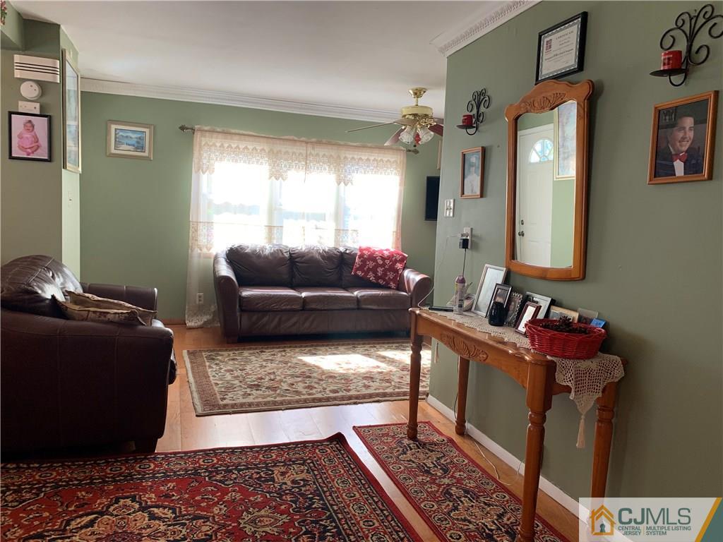 413 Harding Road Old Bridge, NJ 08879 - Photo 6 of 18 a living room with furniture and a window