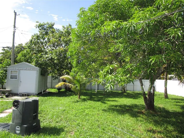 a kitchen with stainless steel appliances granite countertop a refrigerator stove and microwave