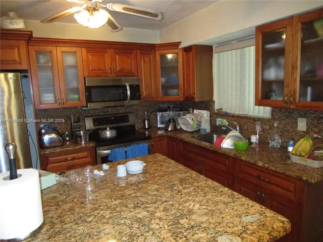 a bathroom with a sink a toilet and bathtub