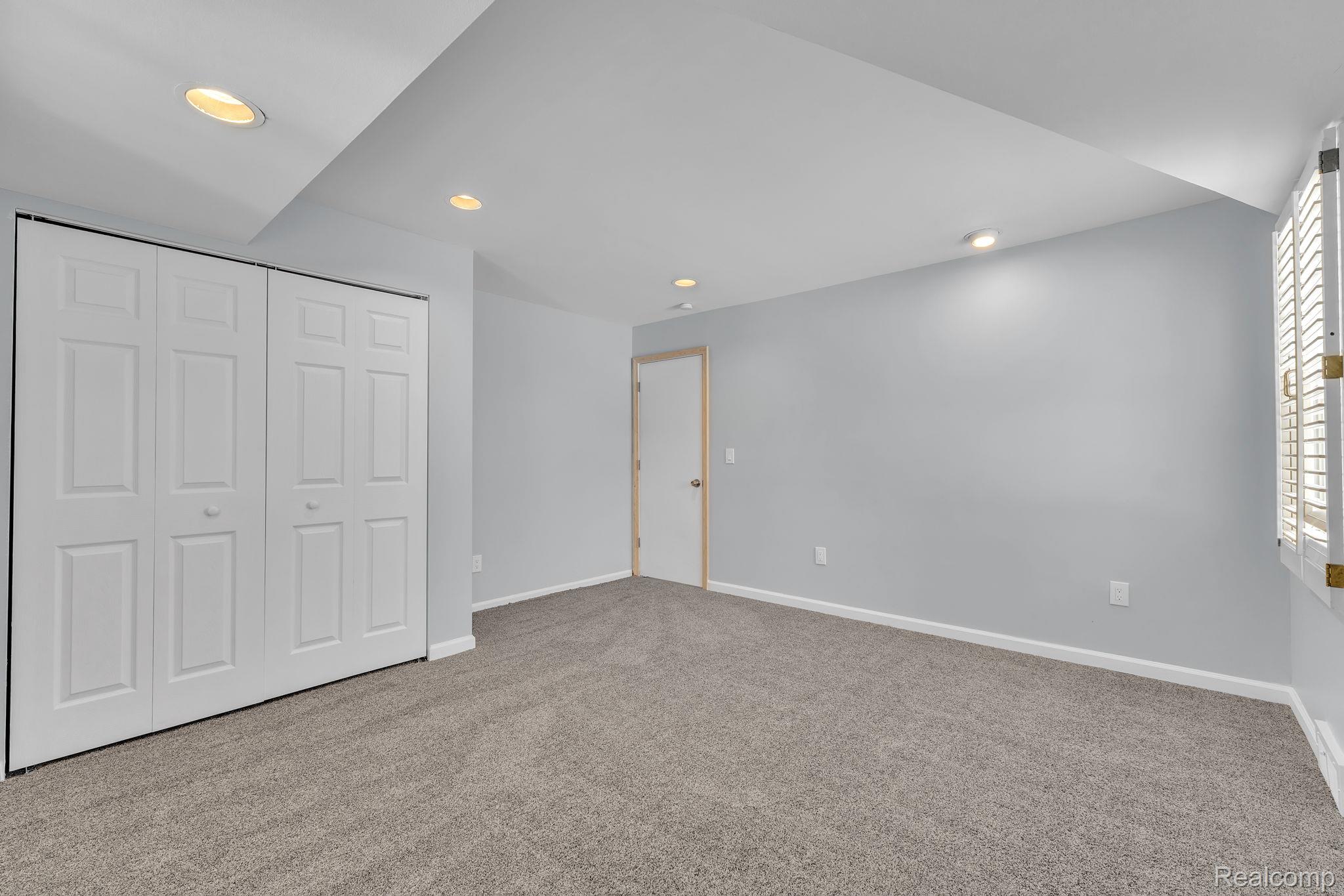 6576 Inkster Road West Bloomfield, MI 48322 - Photo 47 of 62 Unfurnished bedroom featuring recessed lighting, light carpet, and a closet