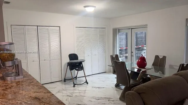 a view of a workspace with furniture