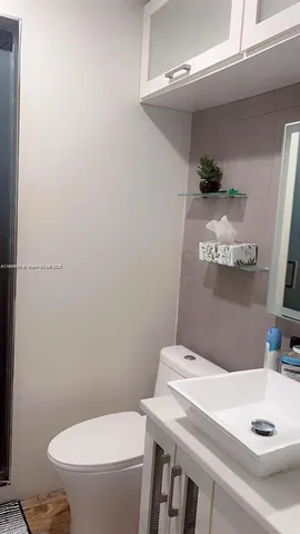 a bathroom with a sink and a toilet