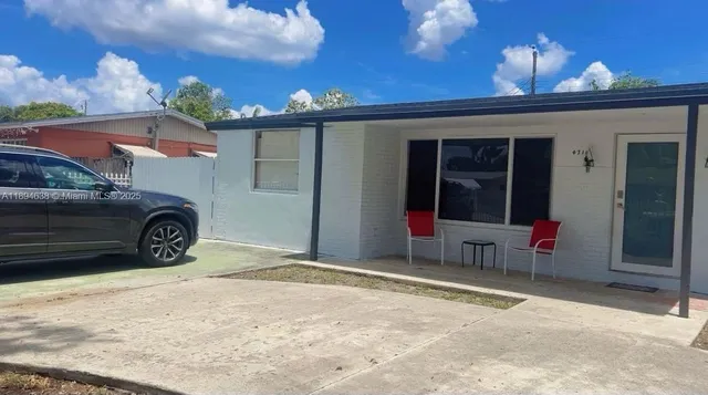 a blue house with a outdoor space