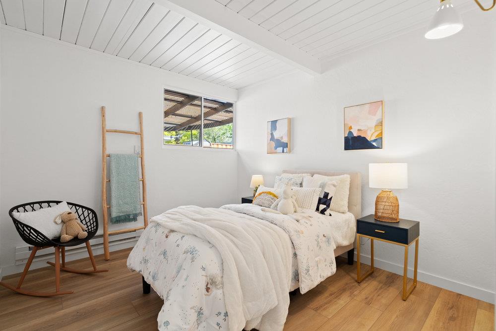 1669 Eleanor Drive San Mateo, CA 94402 - Photo 17 of 31 a bedroom with bed and a chair