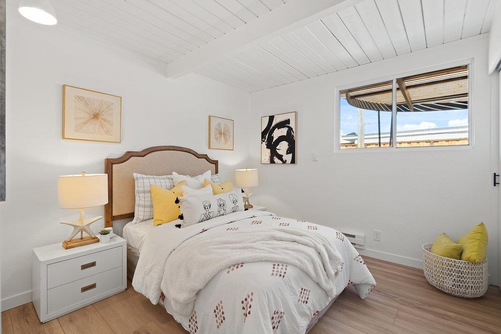 1669 Eleanor Drive San Mateo, CA 94402 - Photo 18 of 31 a bedroom with a bed and wooden floor