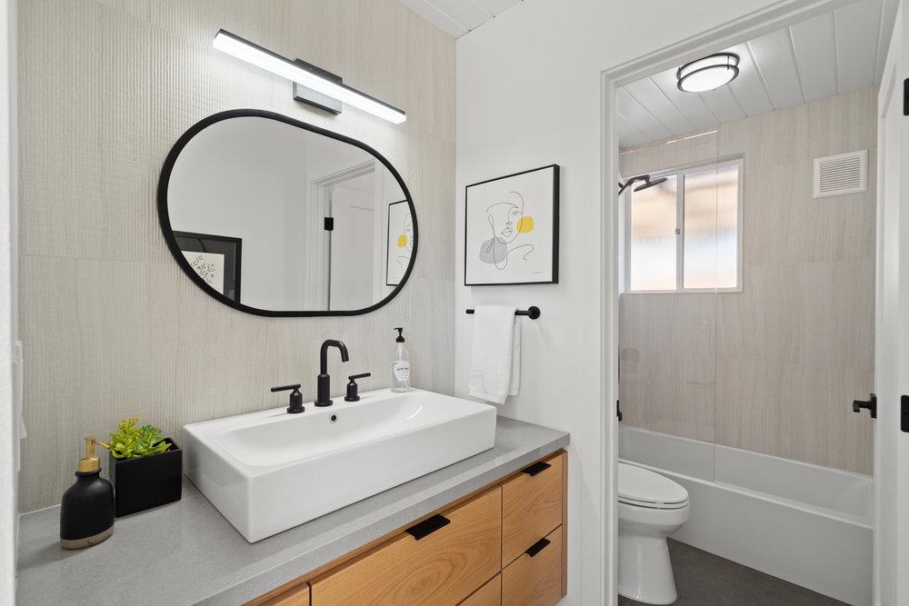 1669 Eleanor Drive San Mateo, CA 94402 - Photo 24 of 31 a bathroom with a sink a toilet and a mirror