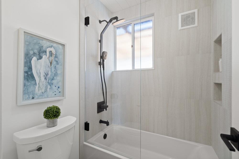 1669 Eleanor Drive San Mateo, CA 94402 - Photo 25 of 31 a bathroom with a bathtub a shower and a toilet