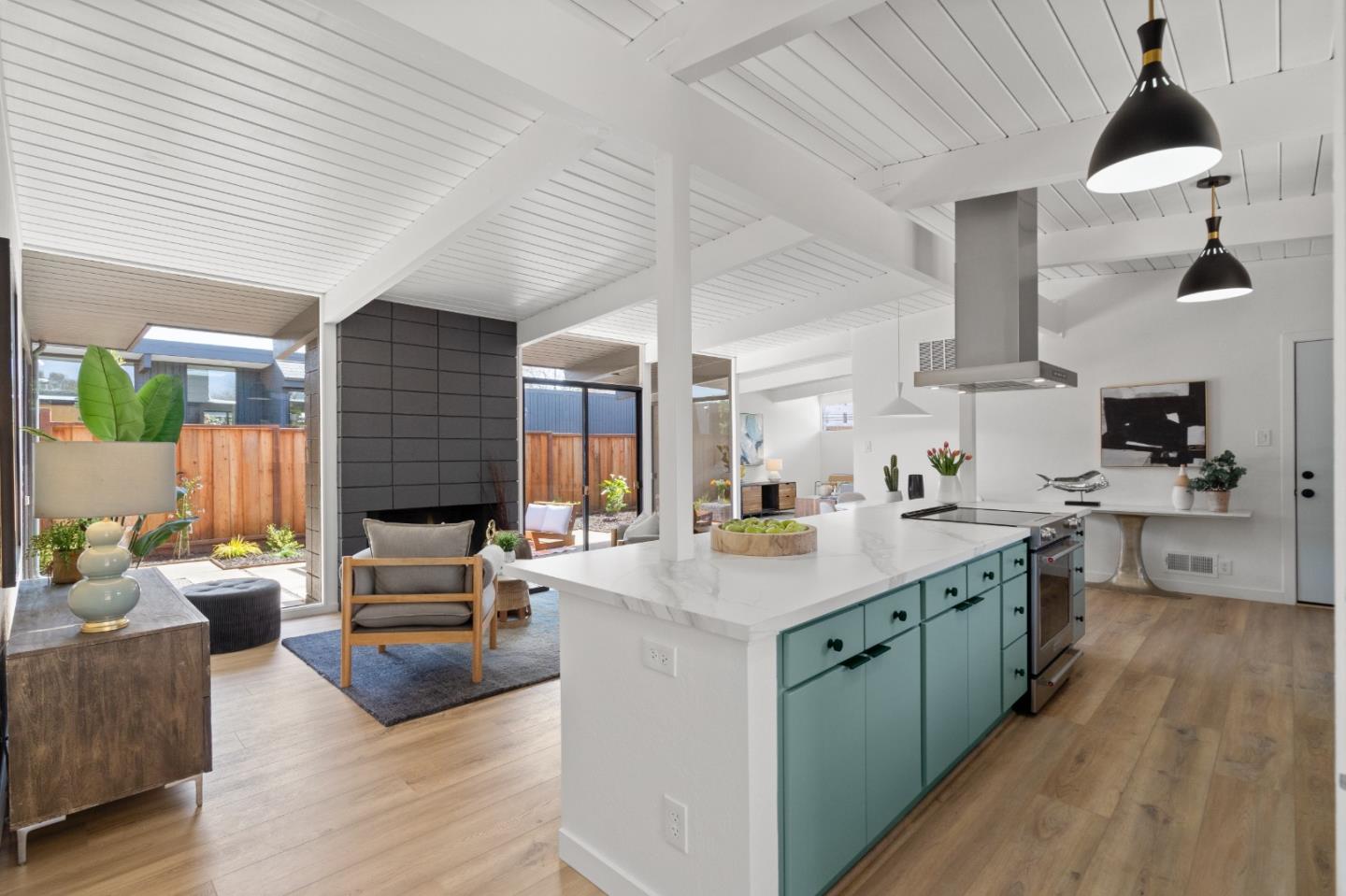 1669 Eleanor Drive San Mateo, CA 94402 - Photo 4 of 31 a open kitchen with stainless steel appliances granite countertop a stove and a wooden floors