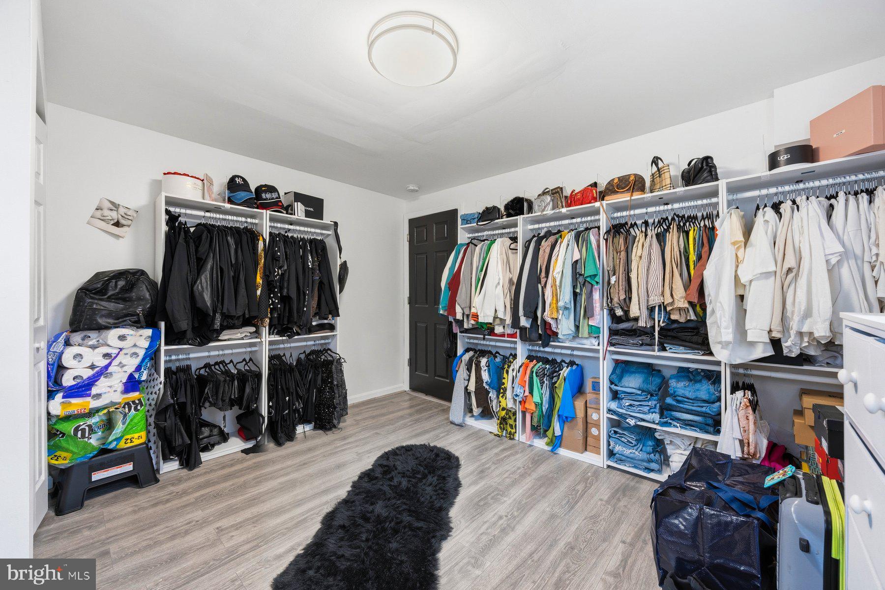 3805 Ridgecroft Road Baltimore, MD 21206 - Photo 16 of 35 a view of walk in closet with clothes and shoes