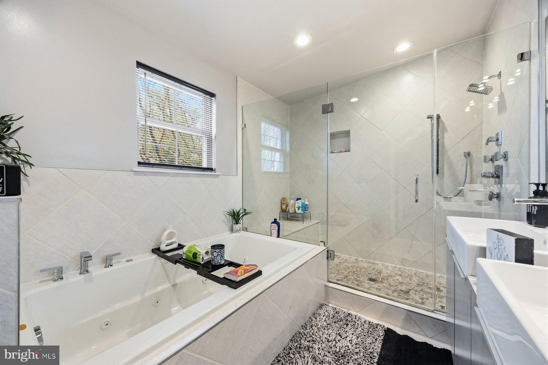 3805 Ridgecroft Road Baltimore, MD 21206 - Photo 24 of 35 a bathroom with a tub sink and mirror