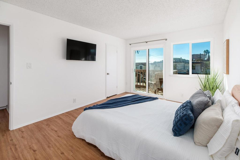 201 4th Street, Unit A/B Encinitas, CA 92024 - Photo 16 of 33 a bedroom with a bed and a television