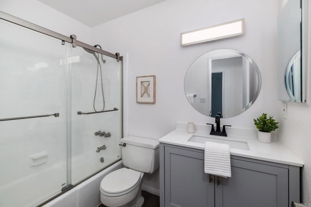 201 4th Street, Unit A/B Encinitas, CA 92024 - Photo 21 of 33 a bathroom with a toilet sink and shower