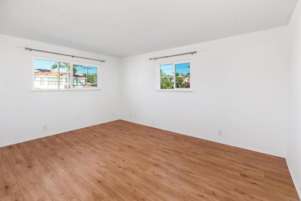 201 4th Street, Unit A/B Encinitas, CA 92024 - Photo 22 of 33 a view of an empty room with wooden floor and a window