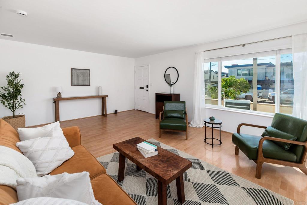 201 4th Street, Unit A/B Encinitas, CA 92024 - Photo 4 of 33 a living room with furniture a table and a large window