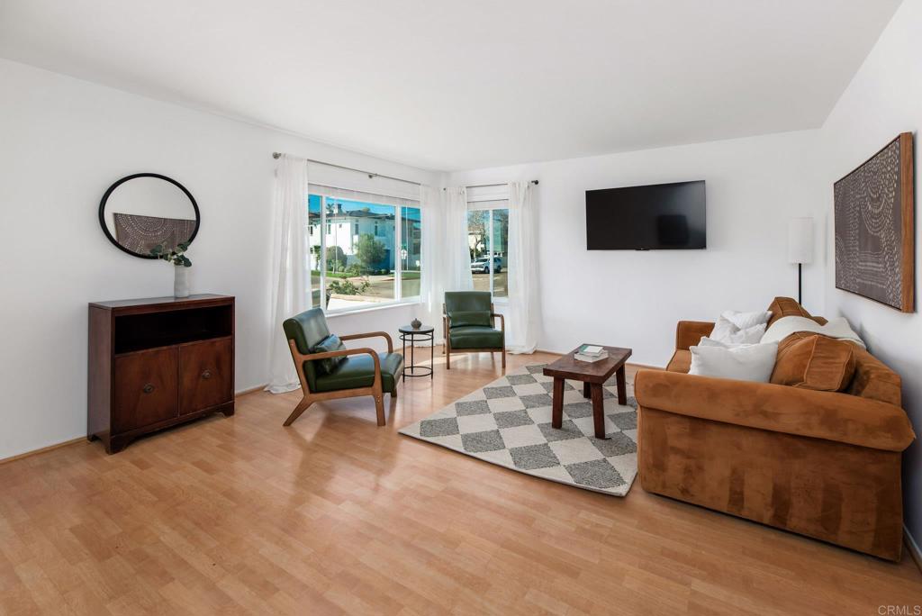 201 4th Street, Unit A/B Encinitas, CA 92024 - Photo 5 of 33 a living room with furniture a fireplace and a flat screen tv