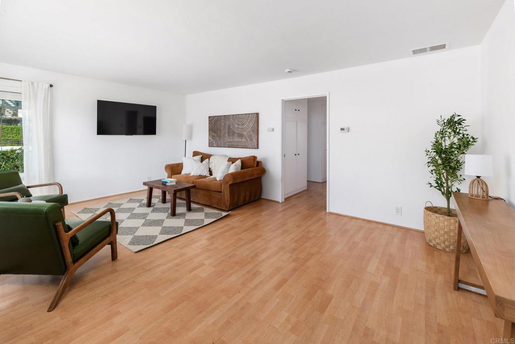 201 4th Street, Unit A/B Encinitas, CA 92024 - Photo 7 of 33 a living room with furniture and a flat screen tv