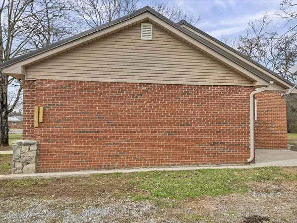 a front view of a house with plants