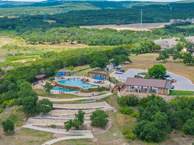 a view of a park with plants and a bench