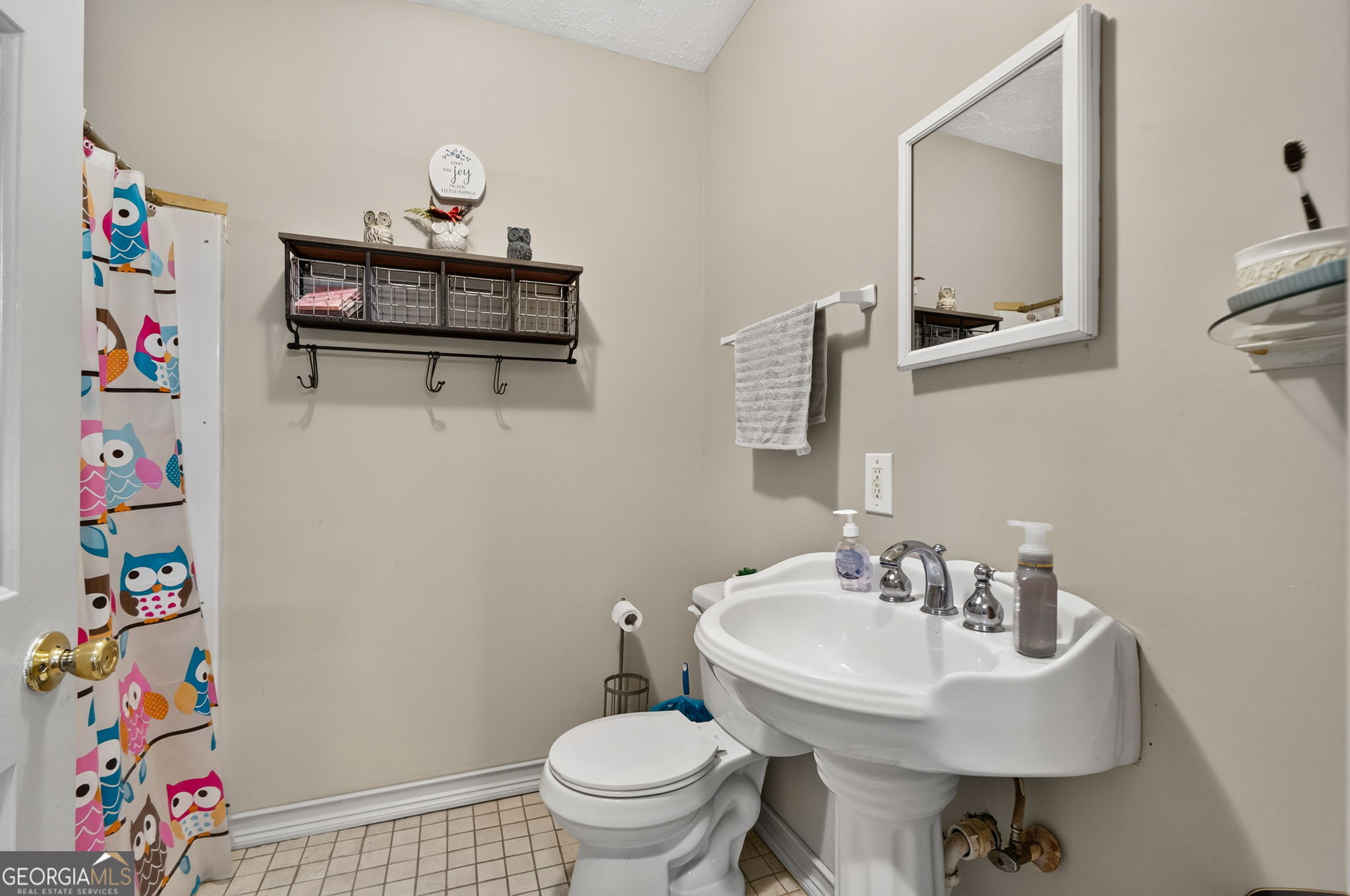 169 Silver Dollar Road Barnesville, GA 30204 - Photo 22 of 66 Full Bathroom Main level, shower, pedestal sink , tile floor