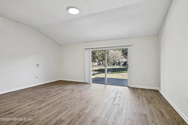 a kitchen with stainless steel appliances a stove refrigerator sink and microwave