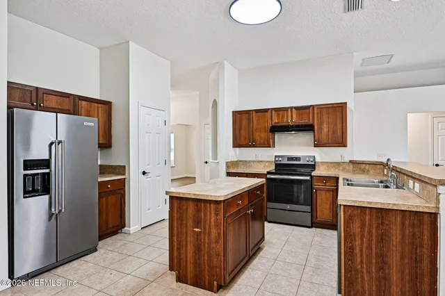 a view white cabinets and sink