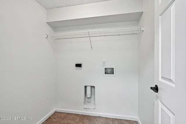 a spacious bathroom with a double vanity sink a large mirror and shower