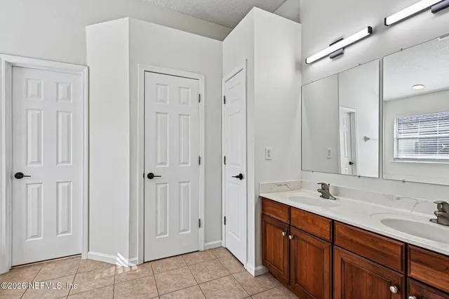 a view of a house with a yard covered with snow