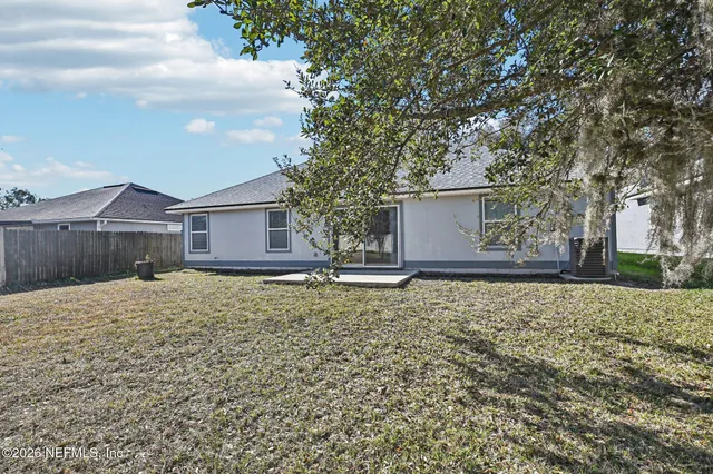 an aerial view of a house with a garden
