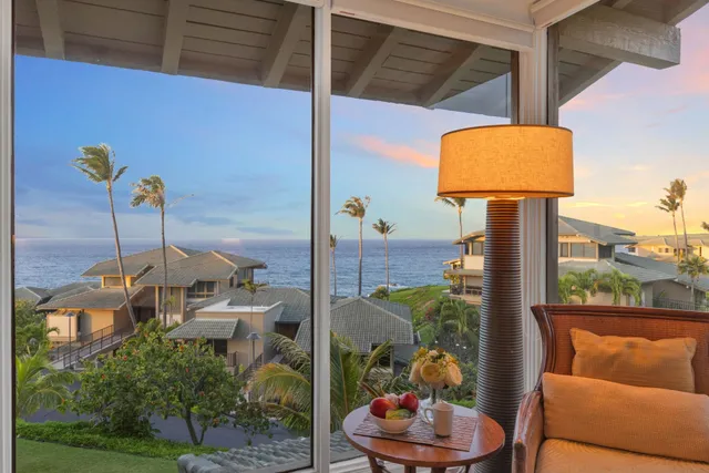 a living room with furniture a table and wooden floor