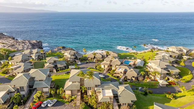 a view of swimming pool with a patio and garden