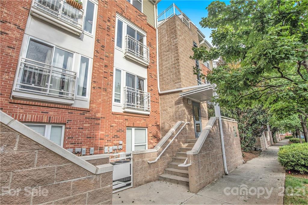 642 Raphael Place Charlotte, NC 28205 - Photo 1 of 27 a view of a building with a wooden door