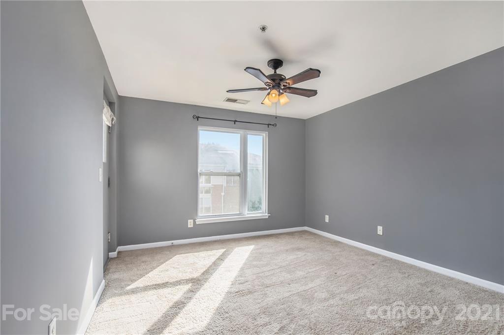 642 Raphael Place Charlotte, NC 28205 - Photo 17 of 27 a view of room with a ceiling fan and a window