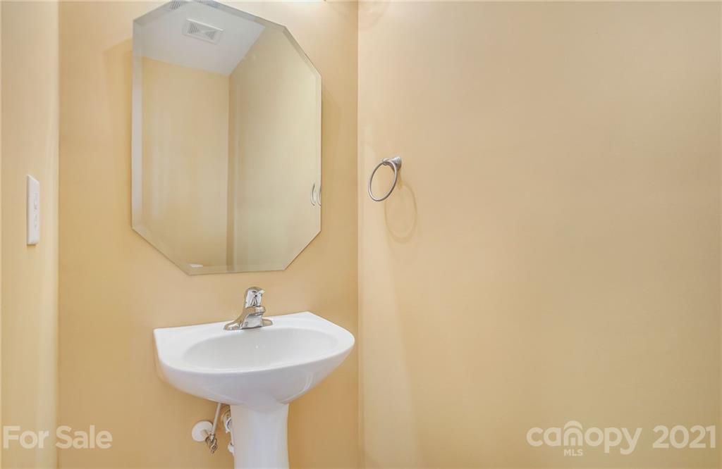 642 Raphael Place Charlotte, NC 28205 - Photo 8 of 27 a bathroom with a sink and a mirror