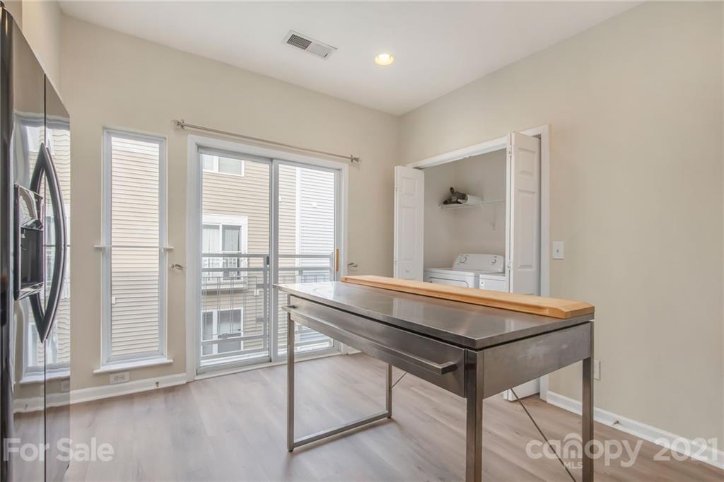 642 Raphael Place Charlotte, NC 28205 - Photo 10 of 27 a room with a table and chairs