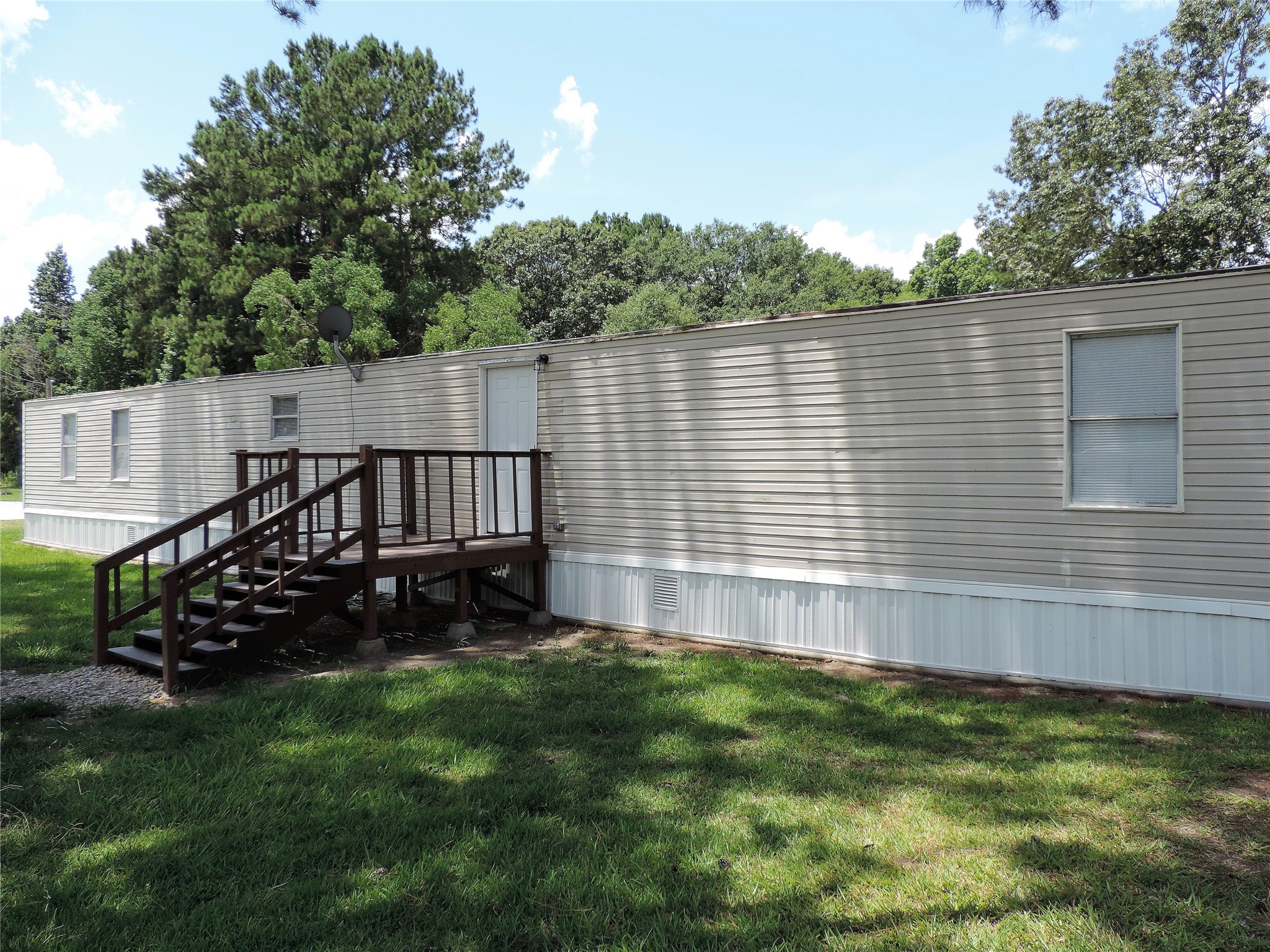 a view of a backyard with sitting area