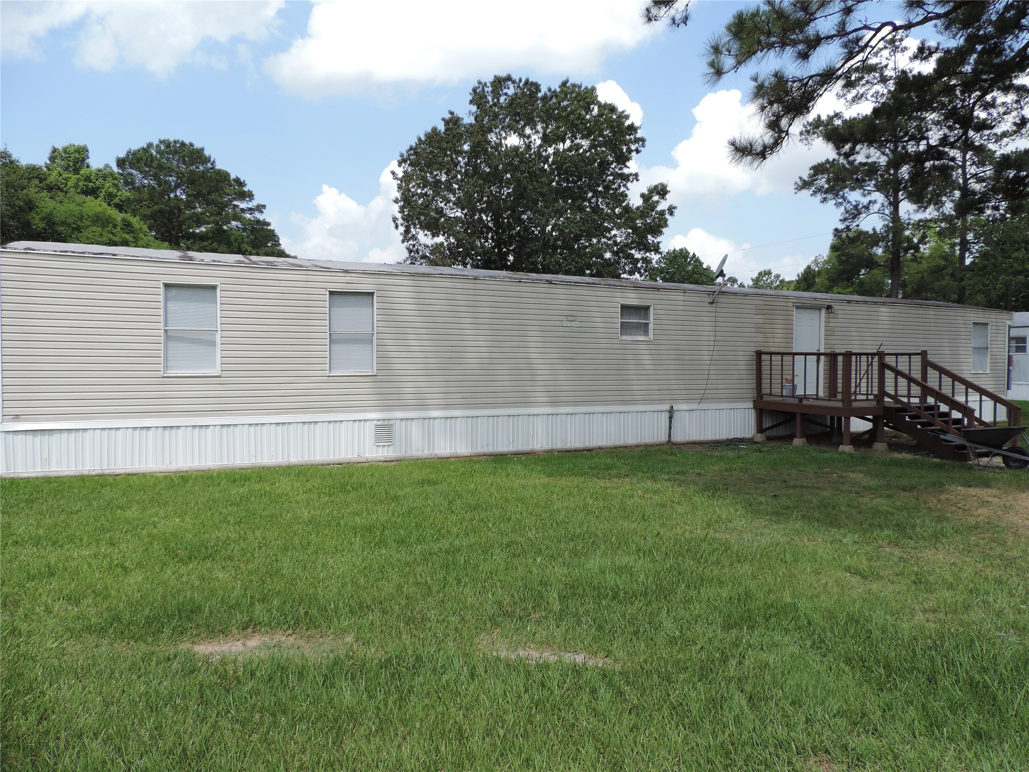 1668 Fm 2518, Unit 85 Cleveland, TX 77327 - Photo 8 of 8 a view of backyard with wooden fence