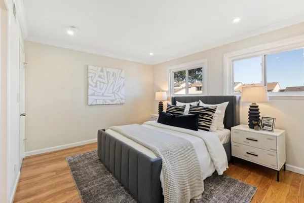 a bedroom with double bed and a window