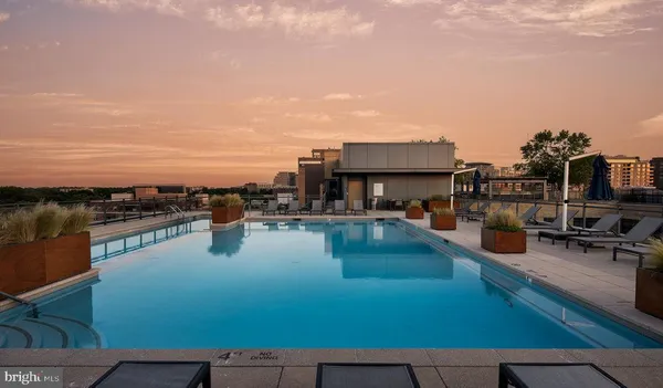 swimming pool view with a lake view