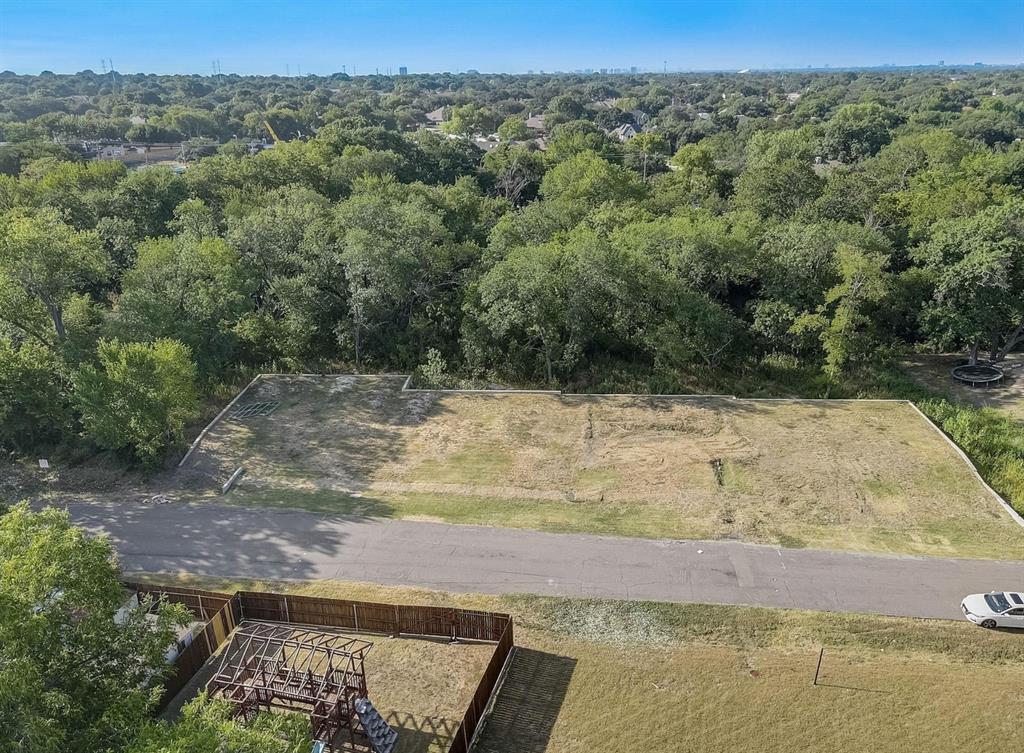 6722 Starbuck Drive Dallas, TX 75252 - Photo 22 of 29 a view of a yard with wooden fence