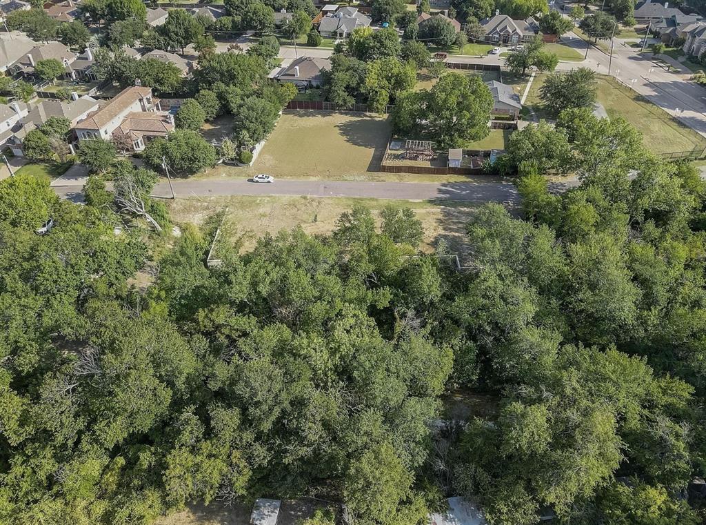 6722 Starbuck Drive Dallas, TX 75252 - Photo 28 of 29 an aerial view of residential house with outdoor space and trees all around