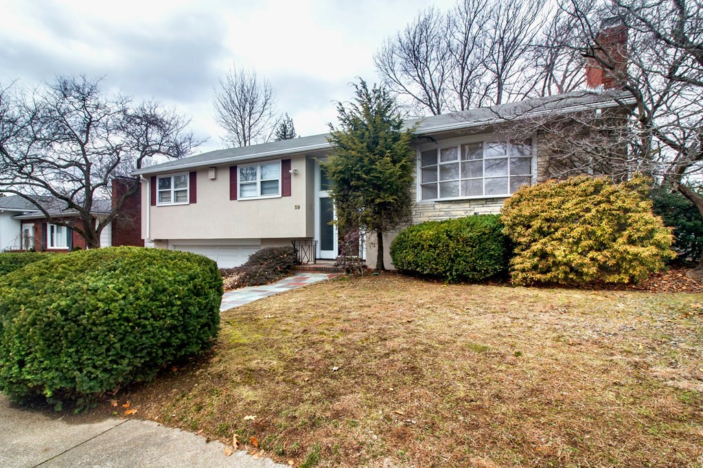 59 Mossdale Road Boston, MA 02130 - Photo 2 of 2 a front view of a house with a yard