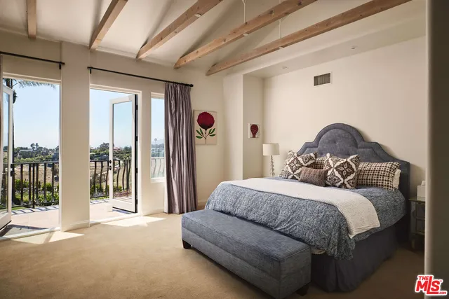 a bedroom with furniture and a fireplace