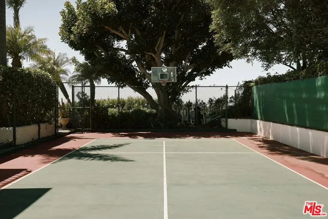 a front view of a house with swimming pool having outdoor seating